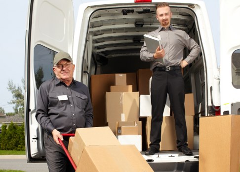 Professional removal services in Brompton with moving team and packed boxes