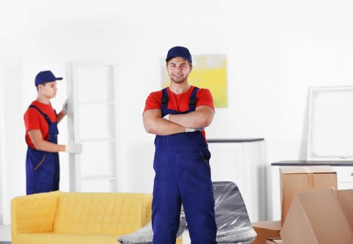 Professional team handling flat removals in Brompton on a narrow residential street