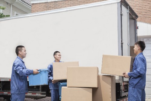 Removal experts handling furniture during a Brompton home move