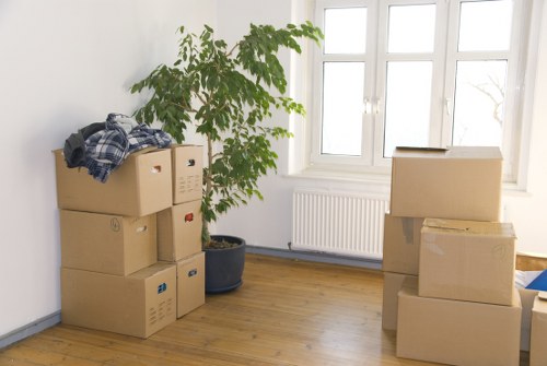 Professional movers packing household items for a Brompton relocation