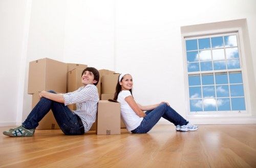 Furniture being safely moved from a Brompton apartment with protective coverings