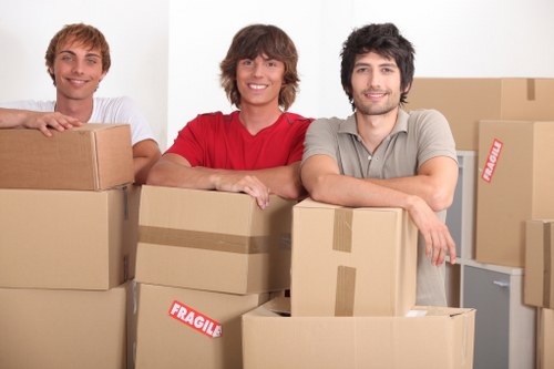 Packed boxes and moving supplies prepared for a Brompton flat removal