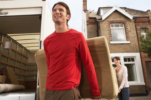 Local moving team handling boxes and furniture in Brompton