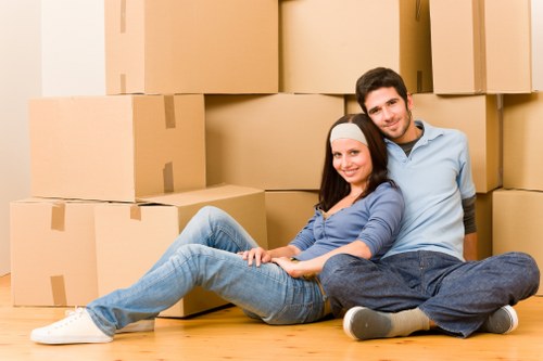 Packed moving boxes ready for collection by a man and van in Brompton