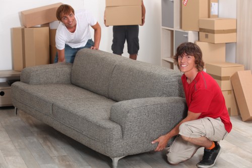 Professional removals crew loading items for a Brompton relocation